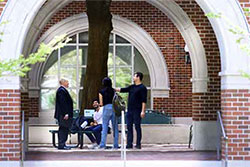 Students chat on Tulane's campus