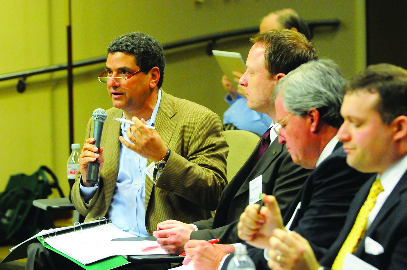 Business Plan Competition judge Gary Solomon, left, asks a question during the business innovation presentations. Also serving as judges in the business innovation track were, left to right, Ron Ondechek, Jimmy Maurin and Ralph Maurer. Not pictured are Crichton Brown and Rick Conway