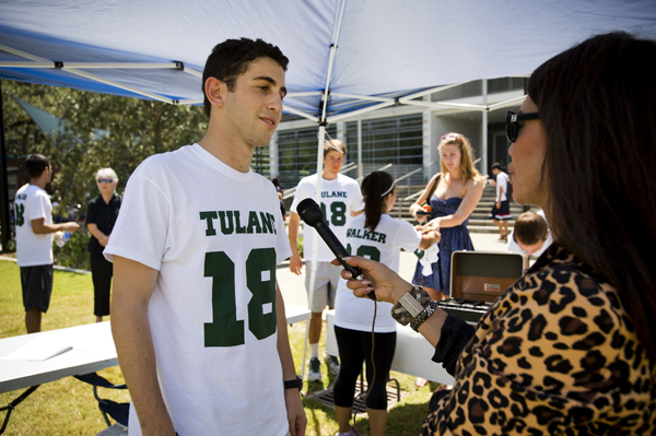 Freeman student Brad Girson (BSM'13), left, has helped raised over $60,000 for injured Tulane football player Devon Walker through the sale of T-shirts.