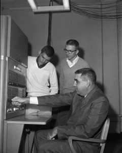 Industrial Management Professor James Sweeney, seated, demonstrates the school’s IBM 650 computer. The Tulane School of Business Administration was one of the first schools in the nation to incorporate computer-based instruction into its curriculum.