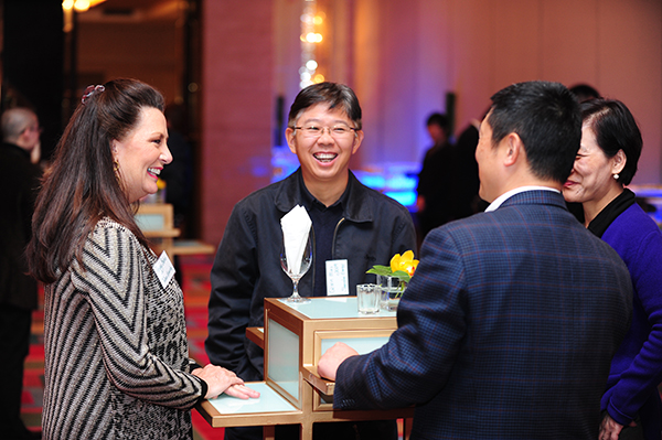 Associate Dean for External Relations Peggy Babin, left, talks with alumni at January's TABA chapter chartering ceremony and reception in Shanghai.