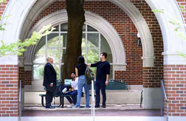 Students talk on Tulane's campus