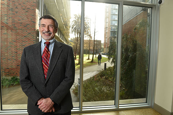 Russ Robins standing in front of window in Goldring/Woldenberg Business Complex