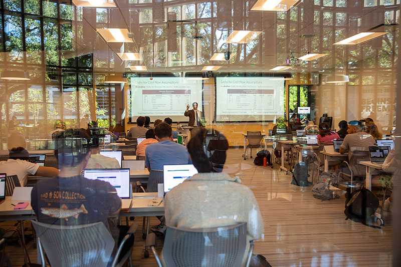 Professor teaching in GWBC glass walled classroom