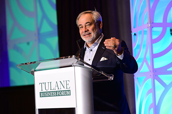 Dan Brouillette speaks at podium for Tulane Business Forum