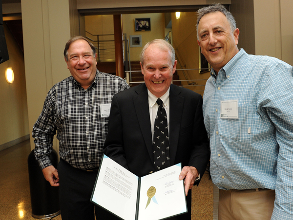 Trapani with former students Stacy Berger, left, and Dave Sislen, right, who led an effort to raise more than $100,000 for the professorship.