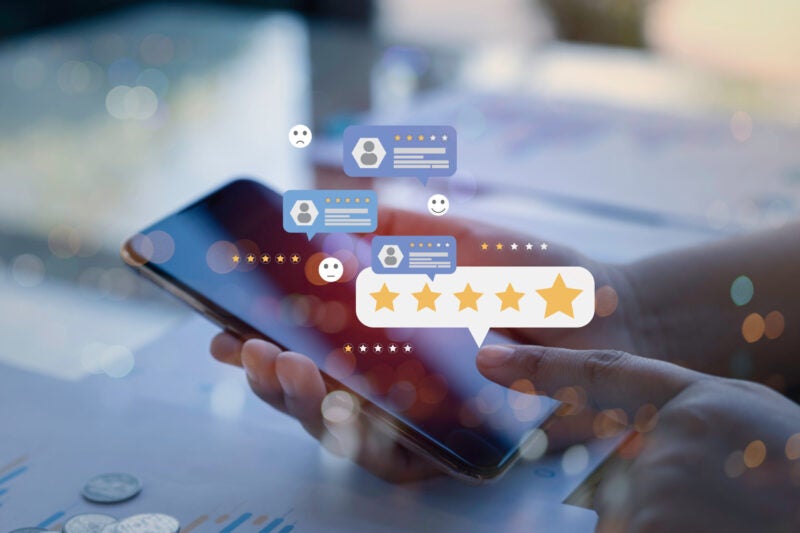 illustration depicting consumer posting online review with a mobile phone